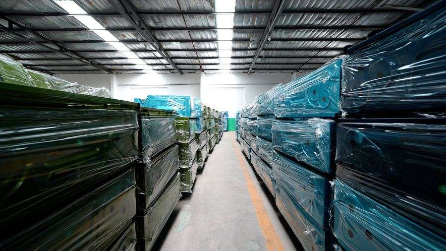 Electric tricycles wrapped and stacked ready for export shipment