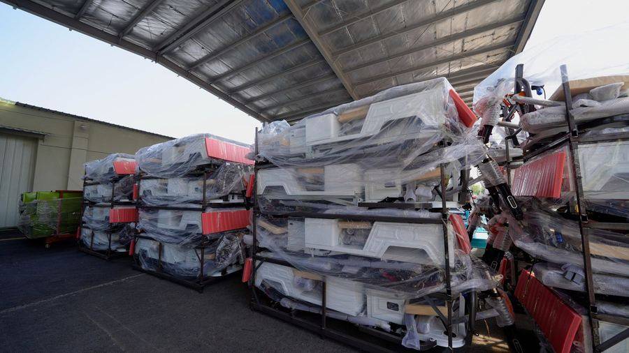 Electric tricycles packed and staged for container loading
